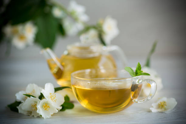 istock Composition with cup of jasmine tea and flowers 1403266033