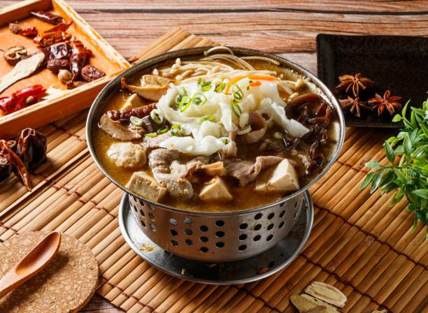 Stinky Lamb hot pot stew with red chili isolated on mat side view of japanese food stock photo