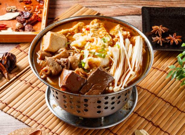 Large intestine Duck Blood hot Pot stew with red chili isolated on mat side view of japanese food stock photo