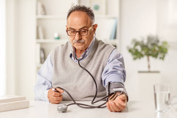 istock Mature man measuring blood pressure 1403266659