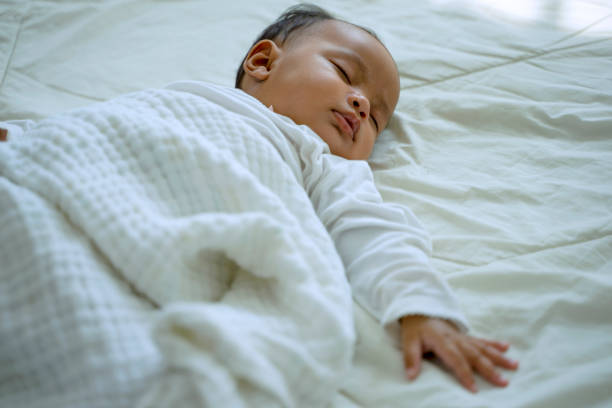 istock Daughter is sleeping alone close to her mother. 1403266877