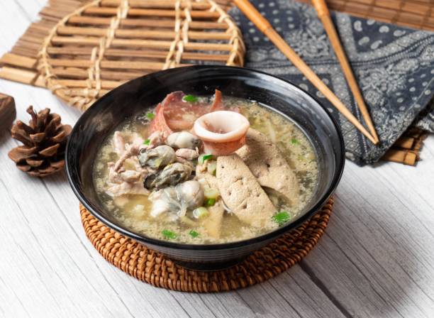 istock Assorted noodle soup in a dish isolated on wood table side view taiwan food 1403267216