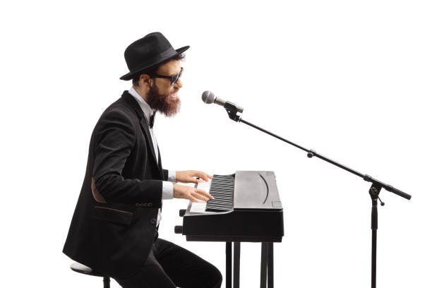 istock Musician playing keyboard and singing on a microphone 1403267747