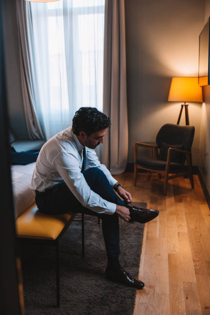 istock Elegant man is getting ready in the morning 1403269074