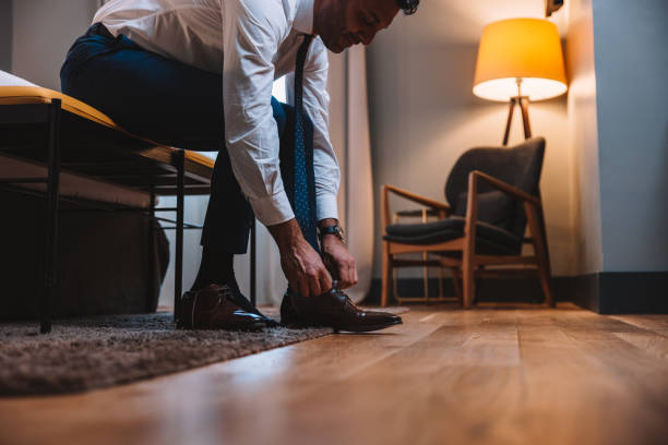 istock Elegant man is getting ready in the morning 1403270384