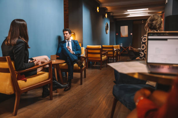 istock People sitting working and relaxing in a cafe 1403272407