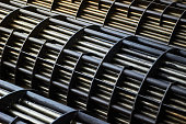 Heat exchangers tube bundle detail of industrial heat exchanger shell and tube condenser, made of steel with corrosion. Abstract industrial background of carbon steel heat exchanger tube bundles.