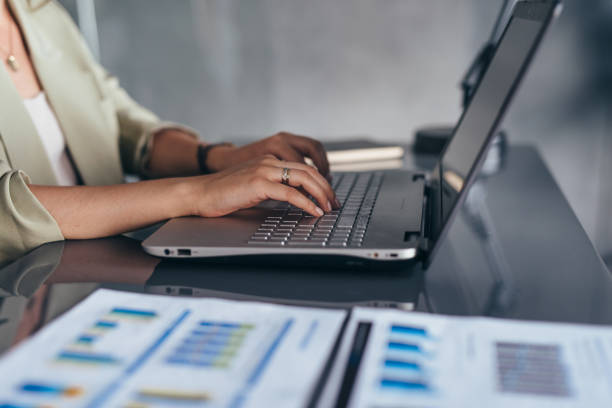istock Woman working typing on laptop keyboard in office. 1403272727