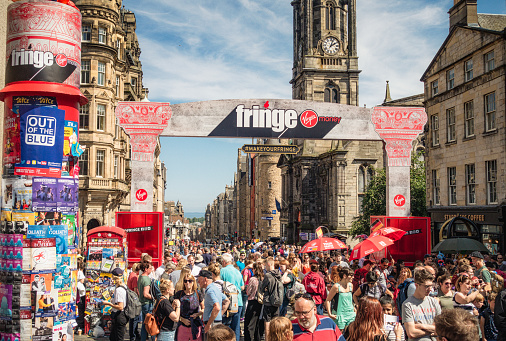Edinburgh, Scotland - People enjoying sunny weather in Edinburgh during the Edinburgh Festival and Festival Fringe in August.