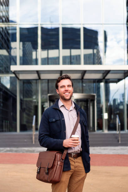 istock happy business man in front of office building 1403276882