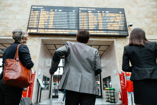 istock Three business people checking departures board at the railway station 1403276907