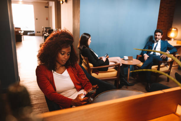 istock Woman texting on mobile sitting in a bar 1403276996