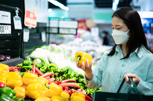 Asian young woman shopping in supermarket