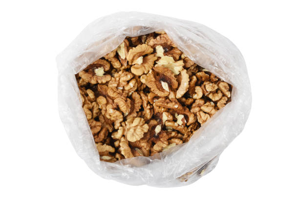 istock Peeled walnuts in the plastic bag isolated on the white background (Clipping Path) 1403278368