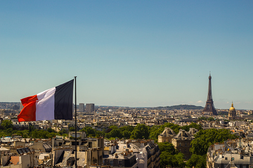 Skyline of Paris, France with French flag