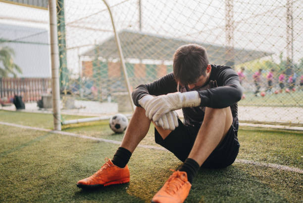 istock Young dribbling a soccer ball up the field during a game 1403281664