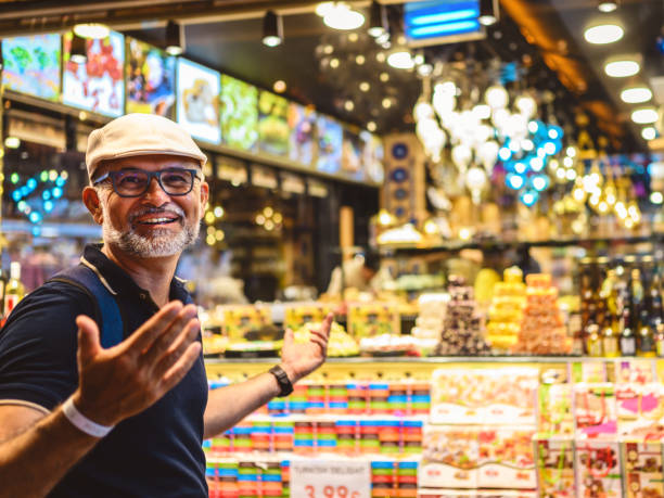 Tourist looks at Turkish souvenirs in the bazaar in Alanya stock photo