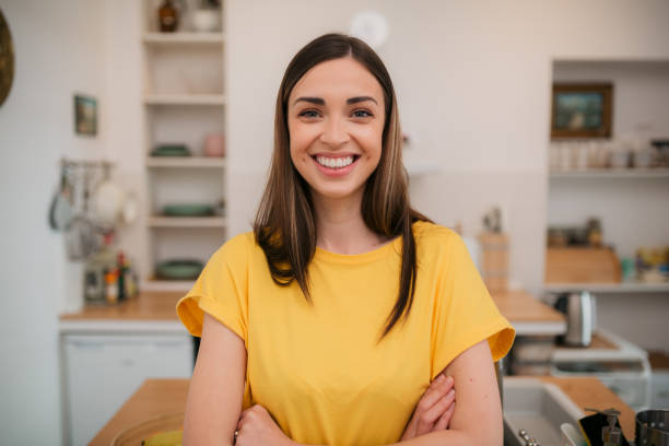 istock Happy young woman at home 1403288462