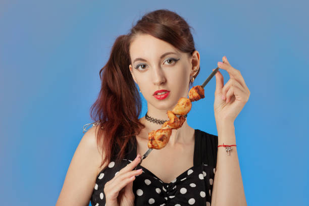 istock woman with grilled meat 1403291435