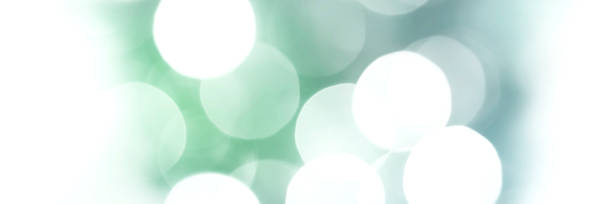 istock Summer green and blue sparkling glitter bokeh background banner 1403291668