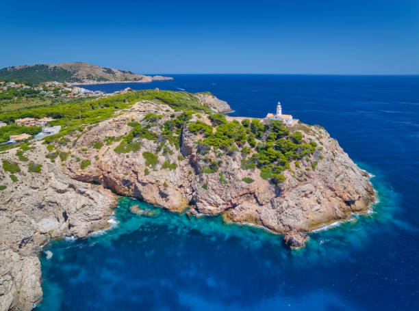 Far de Capdepera is a lighthouse on the northeast coast of the Spanish Mediterranean island of Majorca. It is one of five still in operation of the total of 15 Lighthouses of Majorca. The tower is registered under the international number E-0308 as well as the national code 33350 and irradiates a sector of 148 to 10 degrees. The lighthouse built by the Spanish engineer Emili Pou y Bonet is located near the easternmost point of the island and belongs to the municipality of Capdepera. Inland, the villages of Cala Rajada and Cala Agulla, which are also part of the municipality of Capdepera, are connected to the west.