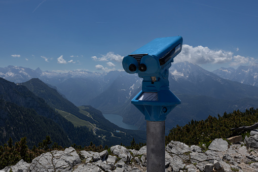 Telescope on top of a mTelescope on top of a mountain in Bavaria allows you to see the peaks of the Alpine mountain rangeountain in Bavaria. High quality photo