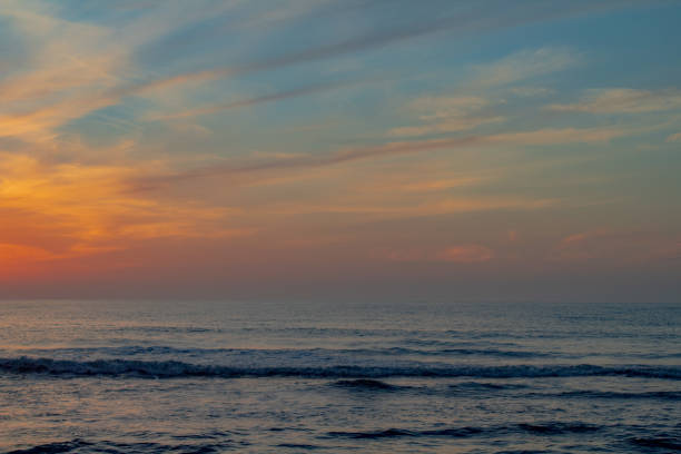 istock Sunrise at the beach and pier 1403295419