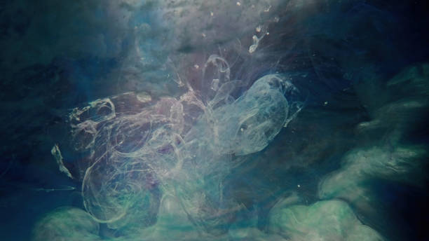 istock ink floating in water color mist cloud green blue 1403295969