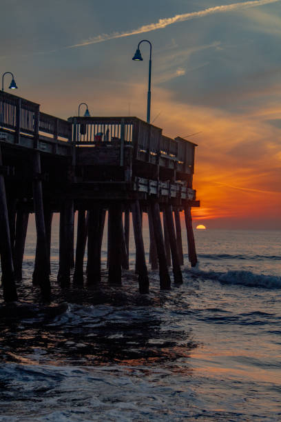 istock Sunrise at the beach and pier 1403295999