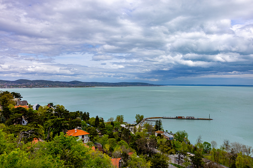 High angle scenic view of lake from forest in tihany abbey against cloudy sky. Balaton.