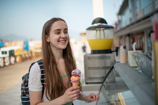 Traveller buying ice-cream at a street