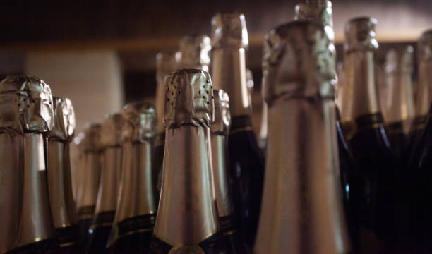 istock Many bottles of champagne on blurred background closeup 1403300247