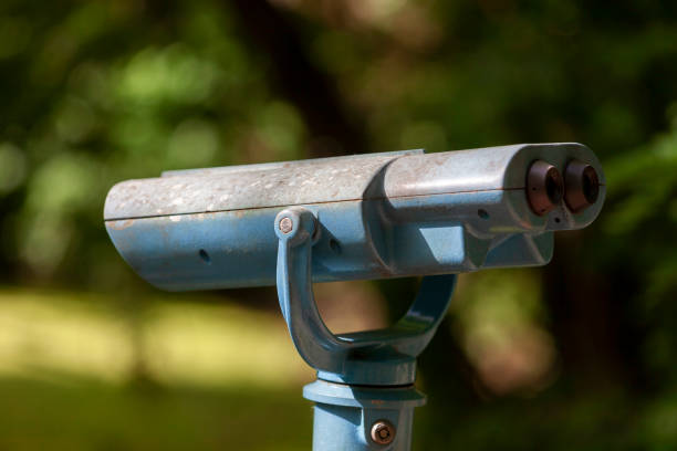 istock Blue Coin operated binocular looking over a lake. 1403302372
