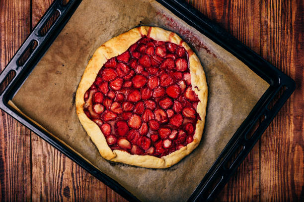 istock Fresh Homemade Strawberry Galette On Baking Tray 1403303118