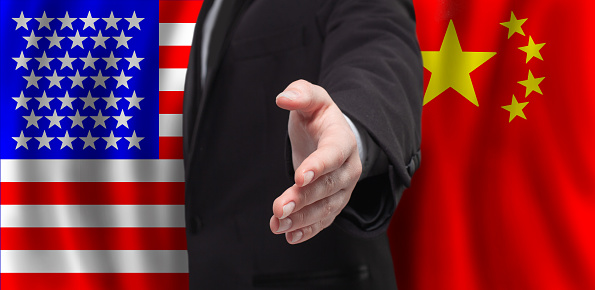Business and politics with USA and China concept. Male open hand for handshake