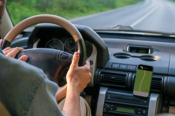 istock Man driving car for travel with navigation on beautiful road 1403304373