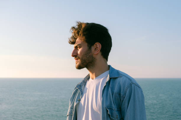 istock Man looking away portrait at sunset 1403307157