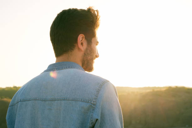 istock Man looking away portrait at sunset 1403307181