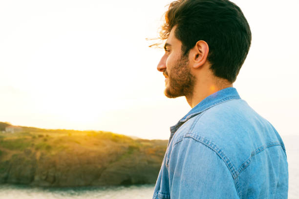 istock Man looking away portrait at sunset 1403307205
