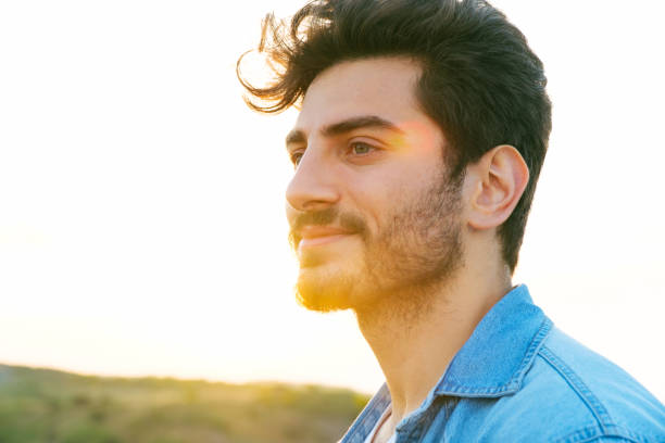 istock Man looking away portrait at sunset 1403307215