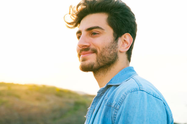 istock Man looking away portrait at sunset 1403307219
