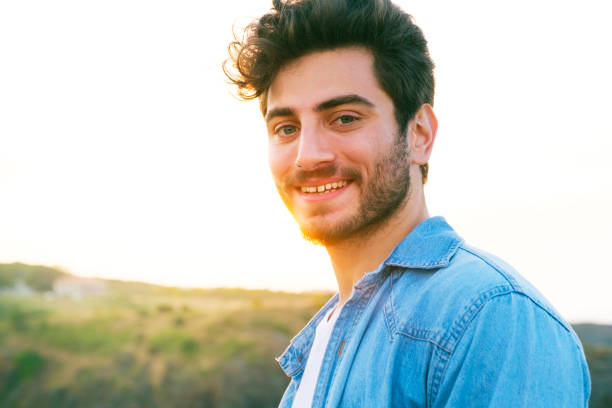istock Man smiling portrait outdoor 1403308031