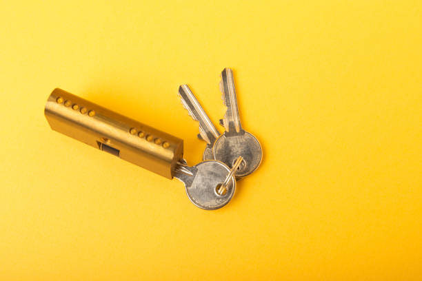 istock New door lock on a yellow background. 1403308209