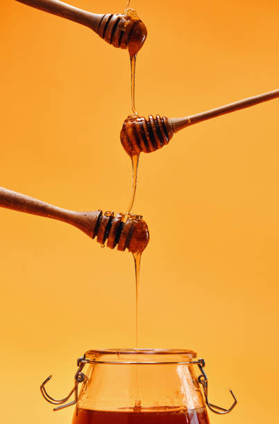 istock Healthy Honey Slowly Dripping 1403309947