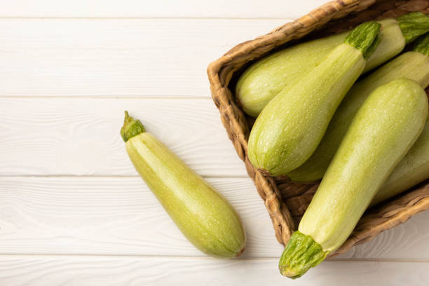 istock Squash vegetable marrow zucchini on white texture background.Vegetarian organic vegetables.Healthy food.Copy space.Place for text 1403310563