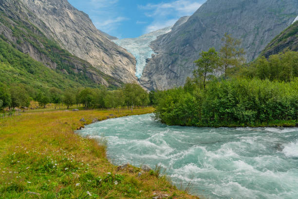 istock Glacier melting stream, Norway,  Jostedalsbreen mountain landscape view. 1403314940