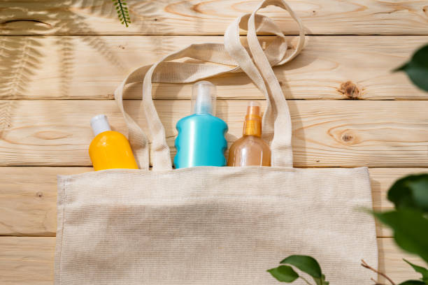 istock Sunscreen cream bottles in beach bag on wooden background 1403316769