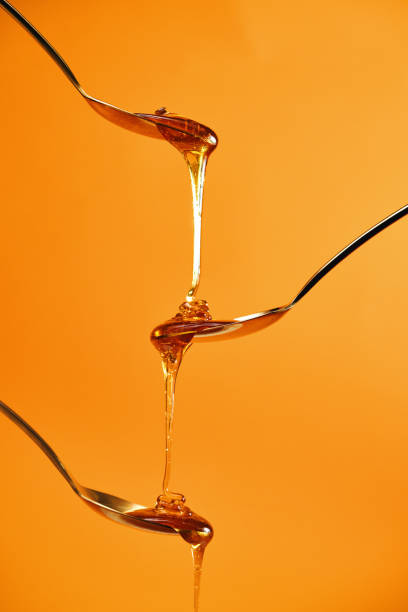 istock Healthy Honey Slowly Dripping 1403317898