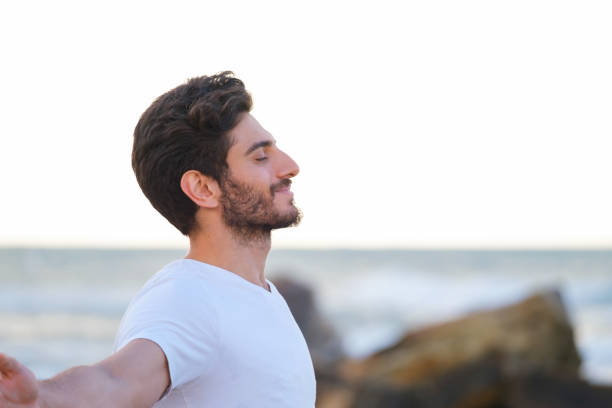 istock Arms raised happy success winning man looking away 1403320290