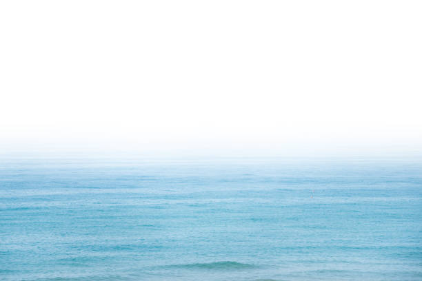 istock Blue sea water with white sky 1403320291